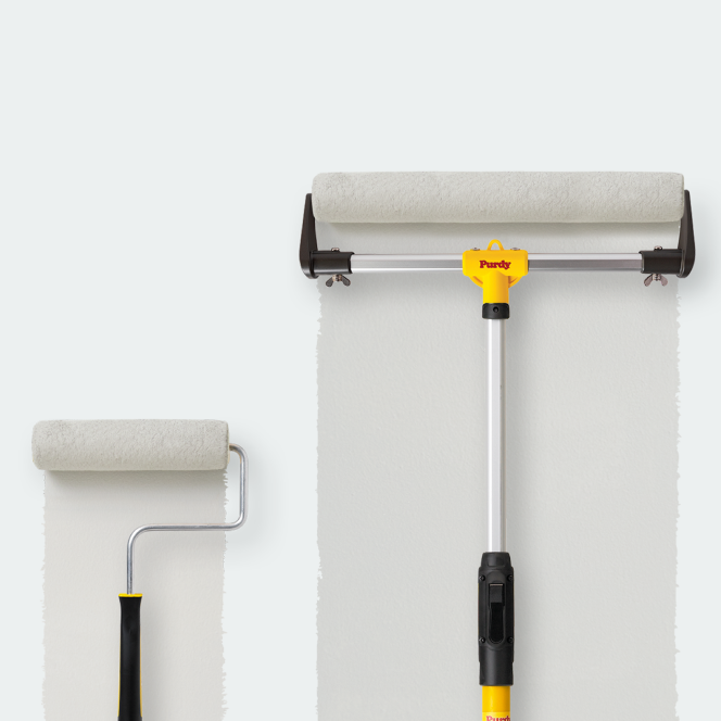 Rolling grey paint on a surface with a smaller roller and an 18" Purdy roller